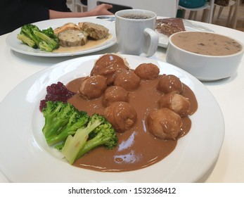 Swedish Traditional Meatballs With Green Vegetable, Mushroom Soup And Black Coffee.