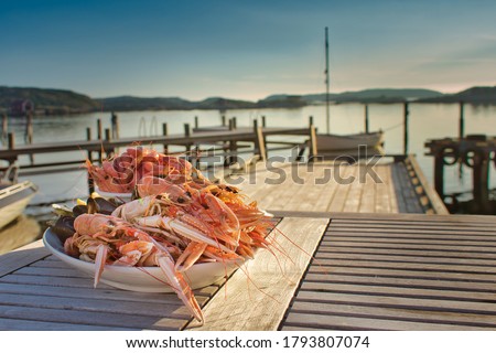 Swedish-style, simple, natural shellfish platter served on a peaceful wooden pier with the tranquil archipelago all around. Fine dining al fresco at its best on a flat calm, balmy summer's evening.