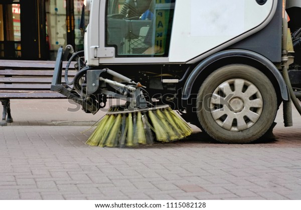 Sweepers car machine or sweeper machine cleaning\
on the streets.