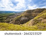A sweeping panoramic view from the River Bend Overlook Trail in Theodore Roosevelt National Park captures the majestic Missouri vista