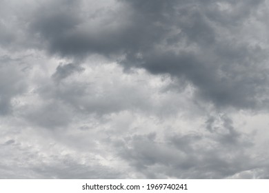 A sweeping pattern of clouds evolving as an intricate background pattern