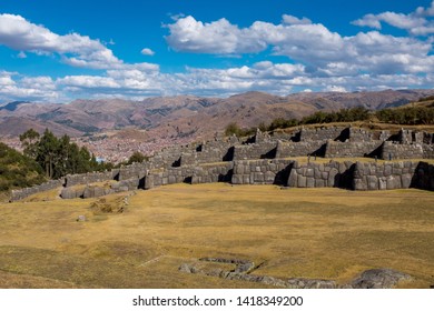 A sweeping view of the incredible Inca ruins of Saqsaywaman, which is just a short walk from the centre of Cusco, Peru, with mountains in the background the site of the last battle for the Incas