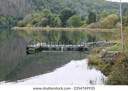 Similar – Stone jetty by the lake