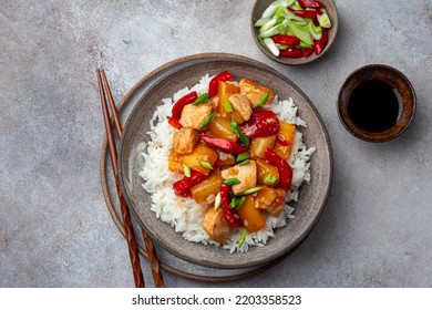 Sweet ad sour chicken with steamed rice, top view - Shutterstock ID 2203358523