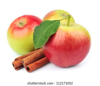 Sweet Apple With Cinnamon Rods On White