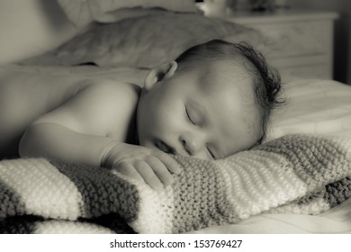 Sweet Baby Asleep On A Blanket