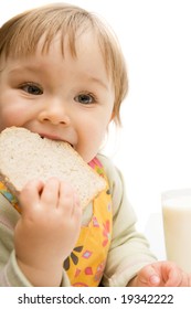 Sweet Baby Girl Eating Bread