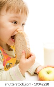 Sweet Baby Girl Eating Bread