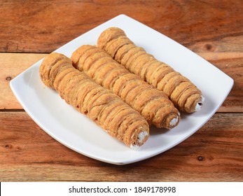 Sweet Bakery Food Puff Roll with Cream also know as Cream Roll, puff pastry is a type of sponge cake roll filled with vanilla cream,