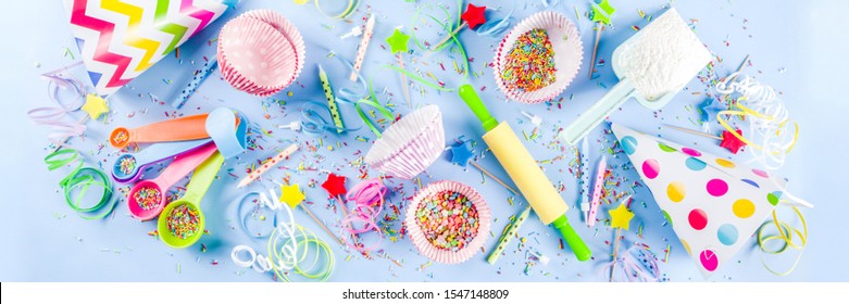 Sweet Baking Concept For Birthday Holiday Party, Cooking Background With Baking Stuff - Rolling Pin, Whipping Whisk, Cookie Cutters, Sugar Sprinkling, Flour. Light Blue Background, Above Banner