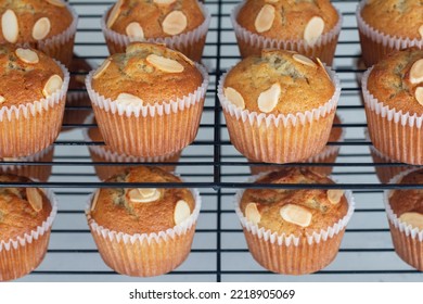 Sweet Banana Muffins Topping With Almond Place On Black Candy Shelf In A Bakery Shop.