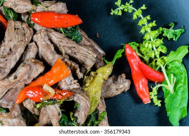 Sweet Basil Beef Stir Fry Isolated In Black Background