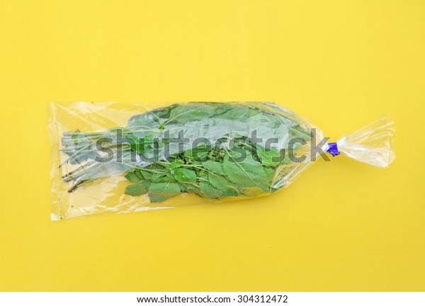 Download Sweet Basil Plastic Bag On Yellow Food And Drink Stock Image 304312472 PSD Mockup Templates