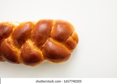 Sweet bread, easter tsoureki cozonac isolated on white background, top view. Braided brioche, festive traditional challah