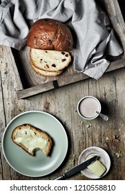 Sweet Bread, Typical Slovak Cake. A Cup Of Cocoa Milk And Piece Of Butter On Plate On Vintage Wooden Background. Overhead Shot.