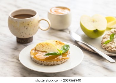 Sweet Breakfast. Crunchy Buckwheat And Rice Snack With Almond Butter And Apple On The Table. Healthy Food Concept