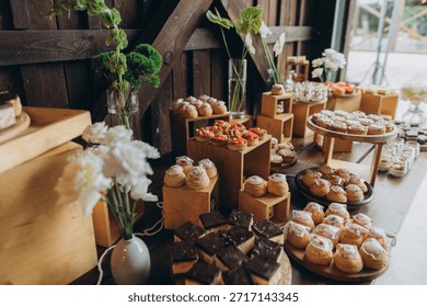 Sweet buffet table presenting an elegant selection of tarts, pastries, and cakes for a festive celebration