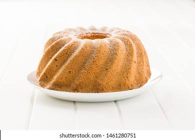 Sweet Bundt Cake On White Table.