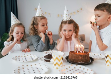 Sweet Cake Is On The Table. Celebrating Brithday. Group Of Children Is Together At Home At Daytime.