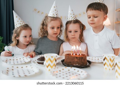 Sweet Cake Is On The Table. Celebrating Brithday. Group Of Children Is Together At Home At Daytime.