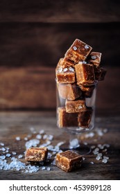 Sweet Caramel Candies. Salted Caramel Pieces And Sea Salt Close Up.

