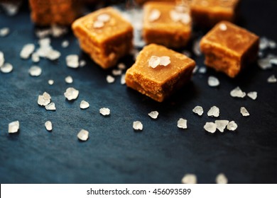 Sweet Caramel Candies. Salted Caramel Pieces And Sea Salt Close Up.

