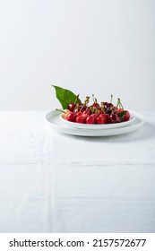 Sweet Cherrys On The White Linen Tablecloth, Selective Focus Image