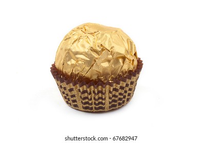 Sweet Chocolate Bonbon In Golden Foil On White Background