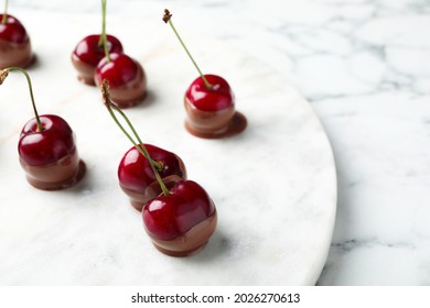 Sweet chocolate dipped cherries on white marble table, closeup. Space for text - Powered by Shutterstock