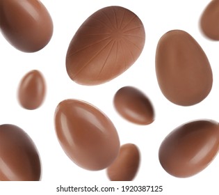 Sweet Chocolate Easter Eggs Falling On White Background