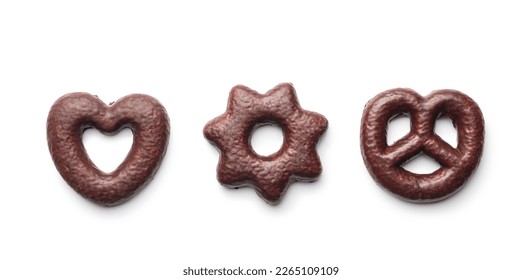 Sweet chocolate heart, star and pretzel isolated on the white background.