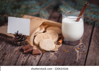 Sweet Christmas Cookies With Milk On Wooden Desks 