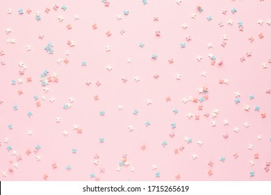 Sweet colorful pastry topping on pink background
