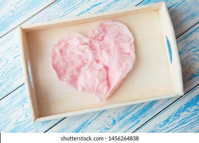 Sweet Cotton Candy In Heart Shape On Blue Wooden Background. Copy Space