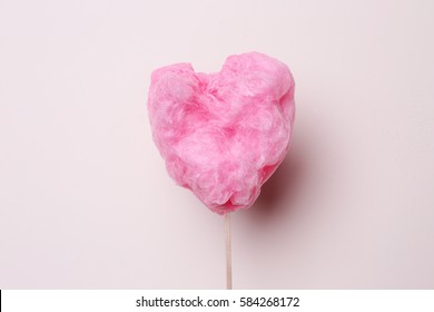 Sweet Cotton Candy In Heart Shape On Light Background