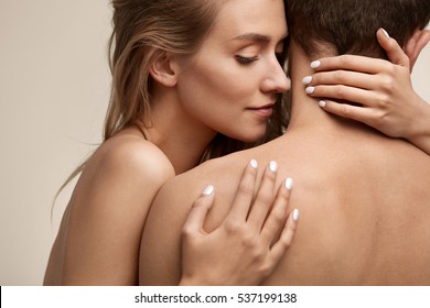 Sweet Couple In Love. Closeup Of Beautiful Sexy Young Woman With  Perfect Natural Makeup Embracing Man With Hands, Smelling Pure Smooth Soft Clean Neck Skin. Body Cosmetics Concept. High Resolution 