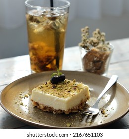 Sweet Creamy Dessert With Blueberry And Cookie Crumbs Garnish On A Ceramic Plate