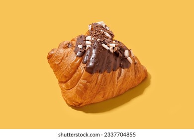 Sweet croissant with chocolate on yellow background - Powered by Shutterstock