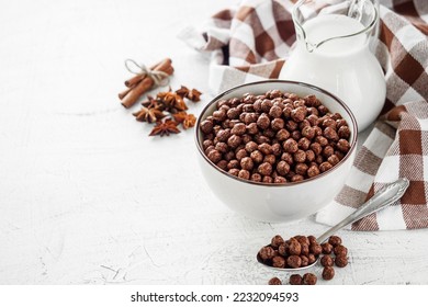 sweet crunchy chocolate children's breakfast chocolate balls on a white background.
