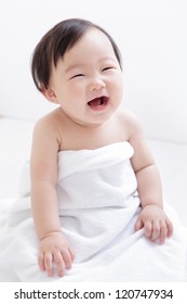 Sweet Cute Girl Baby Smile And Sitting On Bed At Home, Asian Child