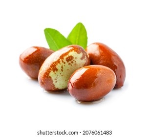 Sweet dates . Jojoba with oil on white backgrounds.