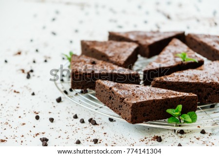 Similar – Chocolate brownie pieces on wooden background