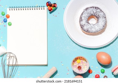 Sweet Dessert Concept, Various Confectionery Tools And Recipe Notebooks On Light Blue Background.