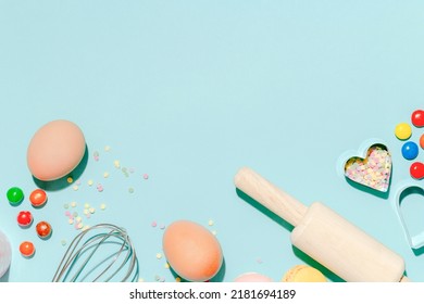 Sweet Dessert Concept, Various Confectionery Tools And Candy Macarons On Light Blue Background.