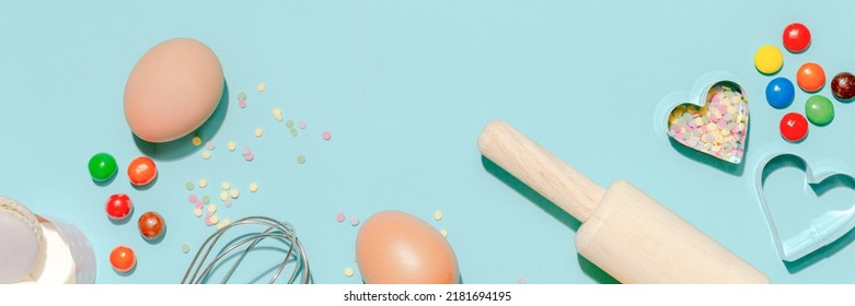 Sweet Dessert Concept, Various Confectionery Tools And Candy Macarons On Light Blue Background.