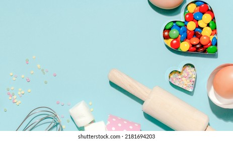 Sweet Dessert Concept, Various Confectionery Tools And Candy Marshmallow On Light Blue Background.