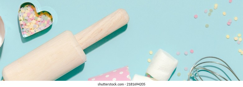 Sweet Dessert Concept, Various Confectionery Tools And Candy Marshmallow On Light Blue Background.