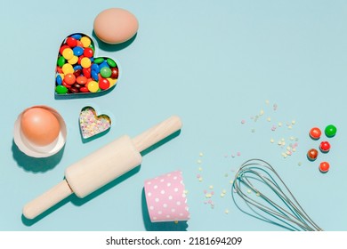 Sweet Dessert Concept, Various Confectionery Tools And Candy On Light Blue Background.