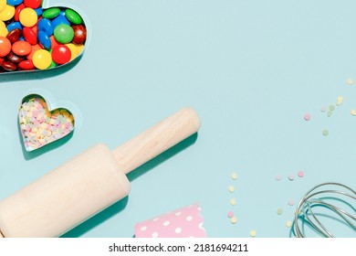 Sweet Dessert Concept, Various Confectionery Tools And Candy On Light Blue Background.