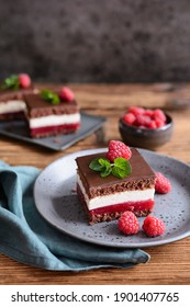 Sweet dessert, delicious chocolate raspberry cheesecake, topped with chocolate frosting